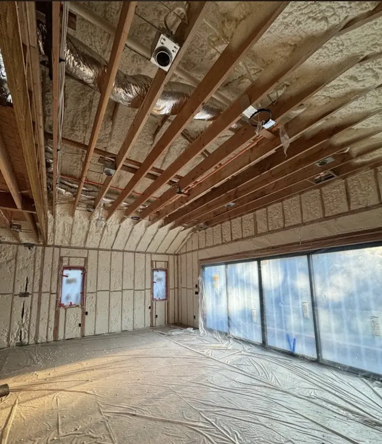 Interior walls and ceiling insulated with spray foam during new construction in Cheval